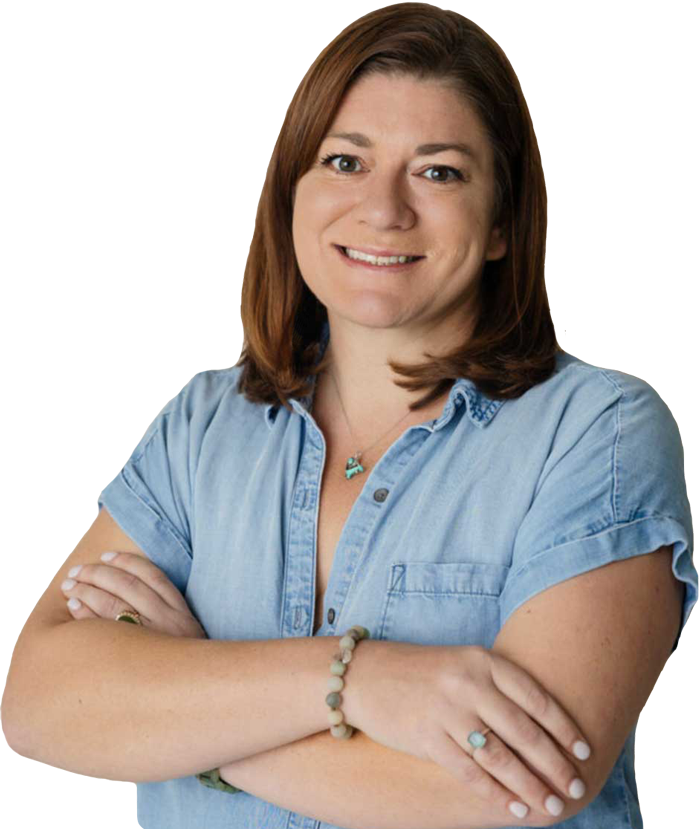 Laura Oldham for Upper Arlington City Council, headshot showing Laura in a denim shirt with her arms crossed and smiling