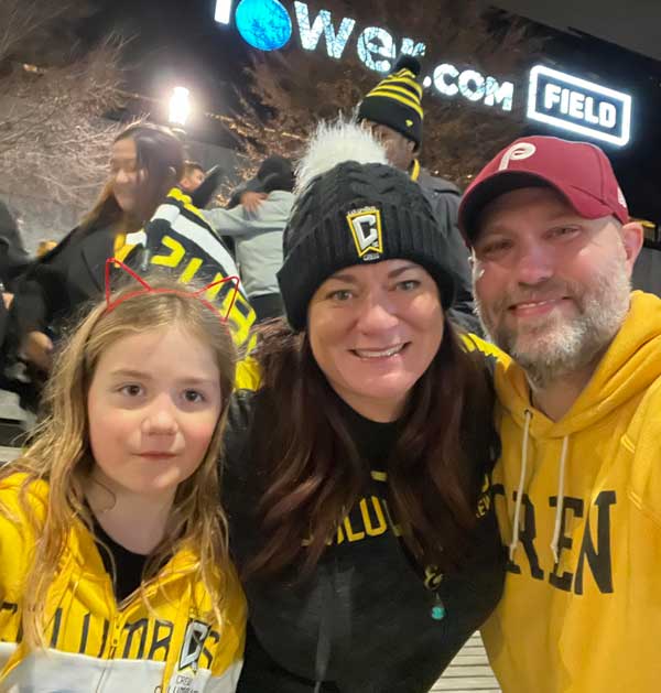 Oldham Family Columbus Crew, Laura, Doug and Violet in Crew gear at Lower.com field watching the 2023 semi-finals